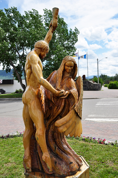 a naked man dancing with an angel.